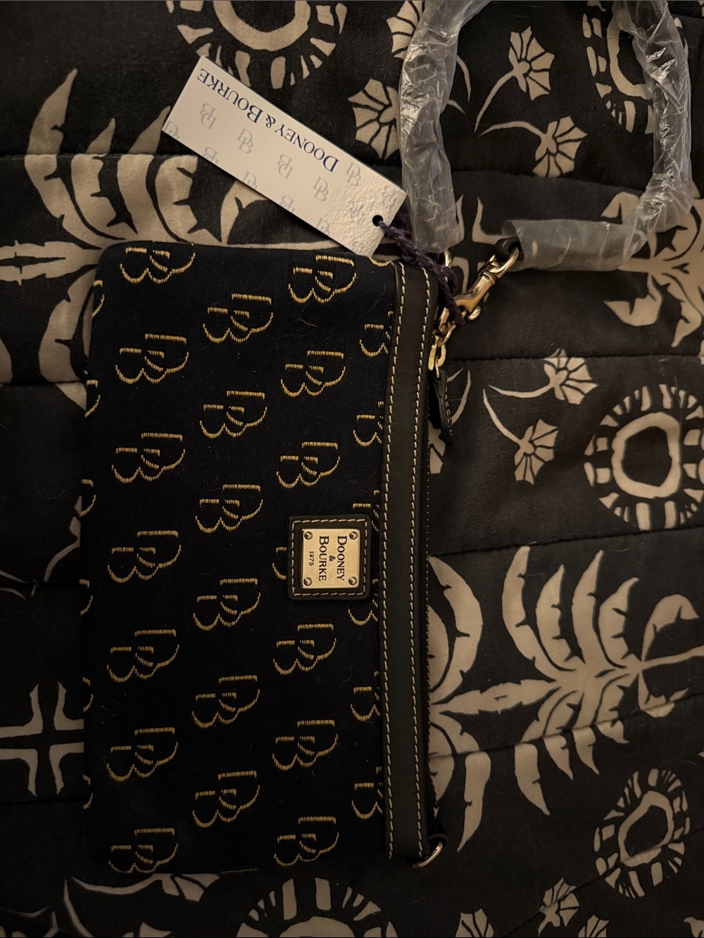 Dooney & Bourke Black and Gold Logo Wristlet